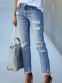 Jeans slim blu chiaro con strappi sulle ginocchia e orli a taglio vivo per uno stile trendy - S / Blu