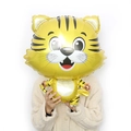 Cute cartoon tiger foil balloon for Chinese New Year decorations held by a model - Gold