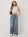 Vista dettagliata dei jeans chiari a gamba larga da donna con strappi alle ginocchia e bordi - 2XL / Azzurro