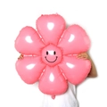 Pink daisy foil balloon with a smiling face for party and birthday decoration - Large Macaron Pink Smiling Daisy