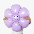 Large lavender purple daisy foil balloon featuring a cheerful black smiley face design - Large Macaron Purple Smiling Daisy