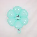 Smiling daisy balloon in mint green finish with flower shape for festive decoration - Small Macaron Blue Smiling Daisy