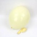 Detail of cream yellow macaron latex balloons showing both inflated and uninflated states - Macaron Yellow