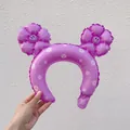Purple inflatable headband featuring white daisy prints and two smiley flower ornaments - 1 Pc Macaron Purple Daisy Headband