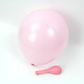 Pink macaron latex balloon shown in both inflated and uninflated states for parties - Macaron Pink