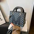 Deep grey tote bag featuring white M jacquard pattern and black leather patch detail - Black