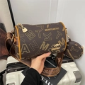 Brown Boston bag with monogram pattern, kangaroo logo, and wide shoulder strap - Brown