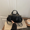 Retro black Boston style handbag with gold buckle details and adjustable strap - Black