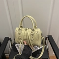 Minimalist creamy yellow pillow crossbody bag with leather texture and fringe zipper - Yellow