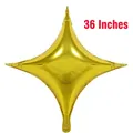 Dettaglio di un palloncino in alluminio dorato da 36 pollici a forma di stella a quattro punte - Oro