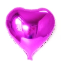 Detail of a magenta heart-shaped foil balloon with a glossy metallic finish on white background - 18-Inch Rose Red Heart