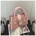Detail of pink textured leather bag with gold M-logo buckle and monogram pattern - Pink