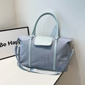 Light blue nylon travel bag with large capacity and shoulder strap for short trips - Blue
