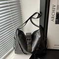 Minimalist black matte leather tote bag with stylish buckle strap and silver hardware - Black