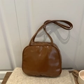 Minimalist dark brown glossy faux leather tote bag with thin double handles and zip top - Brown