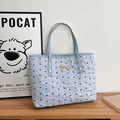 Borsa tote celeste con motivi a fiocco nero e fibbia in metallo dorato centrale - Blu