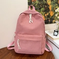 Detalle de la textura de la mochila de pana rosa con bolsillo frontal y bolsillos laterales - Rosa