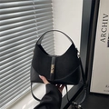 Black hobo bag in mixed matte leather and suede textures with a gold-tone twist lock - Black