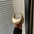 Golden crescent evening bag with mirror finish and circular cutout handle for women - Gold