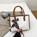 White textured leather tote with brown handles and a heart-patterned silk scarf decor - Brown