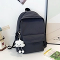 Detail view of dark grey checkered backpack with a white cloud plush keychain accessory - Without Pendant / Gray
