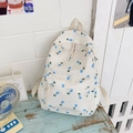 Cream canvas school backpack with blue tulip patterns and large front storage pocket - Blue Tulip Pattern