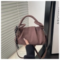 Detail of pleated faux suede brown bag with knotted handle and heart metal charm decoration - Coffee + Pendant