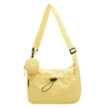 Pale yellow nylon crossbody bag with minimalist utility style and mini round hanging pouch - Yellow