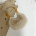 Mini beige faux fur crescent bag with orange beaded strap and soft plush texture - Khaki