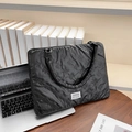 Quilted black laptop sleeve for 14-inch computers featuring cute bow patterns - Black