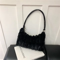Detail of black faux fur shoulder bag with plush striped texture and leather strap - Black