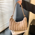 Detailed shot of tie-dye plush handbag with soft faux fur texture and leather strap - Coffee