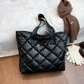 Glossy black quilted tote bag with diamond stitching and padded puffer material - Black
