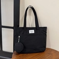 Minimalist black nylon tote bag with small circular pouch and rectangular logo label - Black