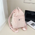 Light pink nylon backpack with adjustable straps and round logo for daily casual use - Pink