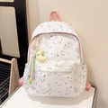 Off-white school backpack with pink and purple star patterns and a moon plush charm - Pink