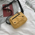 Yellow canvas crossbody bag with adjustable strap and front zipper flap detail - Yellow