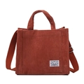 Borsa a tracolla in velluto a coste rosso ruggine con tracolla regolabile ed etichetta - rosso mattone