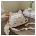 Detail of white nylon cartoon shoulder bag with bear ears and cute plush charm - Off White
