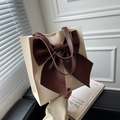 Elegant cream and brown tote bag with large leather bow detail and slim handles - White Base Coffee Bow