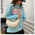 Chic beige nylon crescent crossbody bag paired with light blue love graphic sweatshirt - White