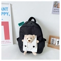 Detail of cute black canvas kids backpack featuring a plush bear in a corduroy front pocket - Black