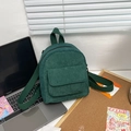 Close-up of deep green corduroy mini backpack with ribbed texture and front pocket - Dark Green