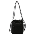 Black corduroy drawstring bucket bag with adjustable strap and front zipper pocket - Black