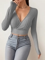Detail of grey ribbed knit long sleeve crop top with cross deep V-neck and slim fit cut - S / Gray