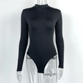 Detail of black long sleeve bodysuit featuring a front zipper and mock neck collar - S / Black