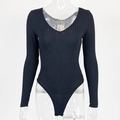 Detail of black ribbed knit bodysuit featuring a deep V-neckline and slim fit long sleeves - S / Black