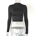 Macro detail of high neck black crop top with tight elastic ribbed fabric texture - S / Black