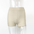 Detail of ribbed knit texture and elastic wide waistband on beige cotton hot pants - S / Khaki