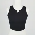 Detail of black ribbed knit crop top featuring a stylish notch V-neckline on a mannequin - S / Black